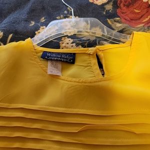 Bright yellow shell with pleats on the bodice.  Short sleeve